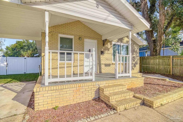 doorway to property with a porch