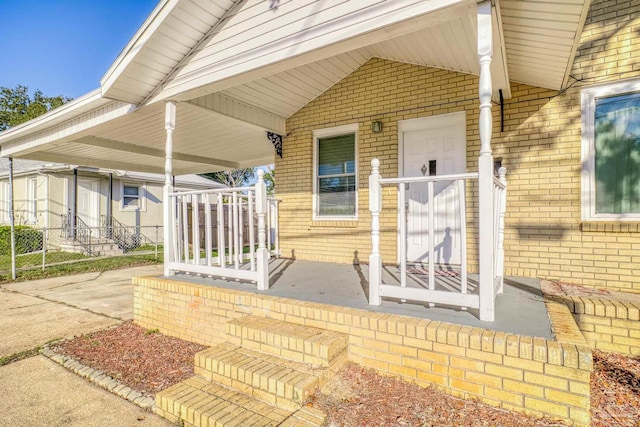 entrance to property featuring covered porch