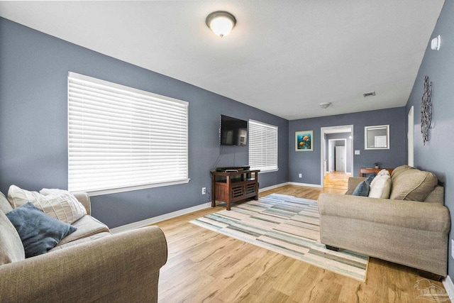 living room with light hardwood / wood-style floors