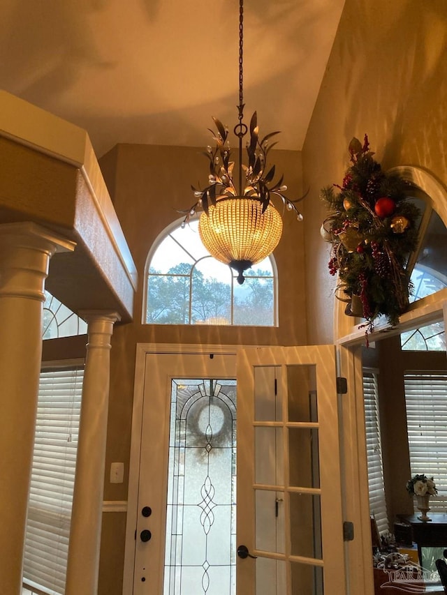 interior details featuring ornate columns and a notable chandelier