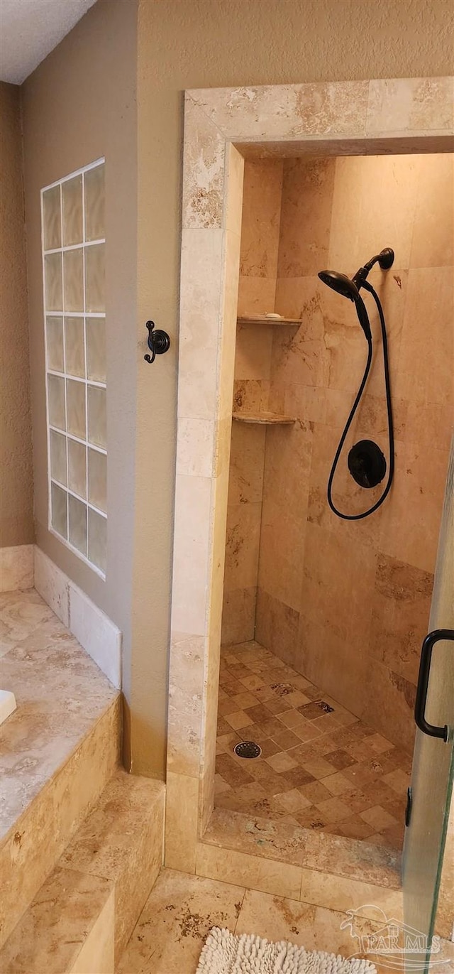 full bathroom featuring a stall shower