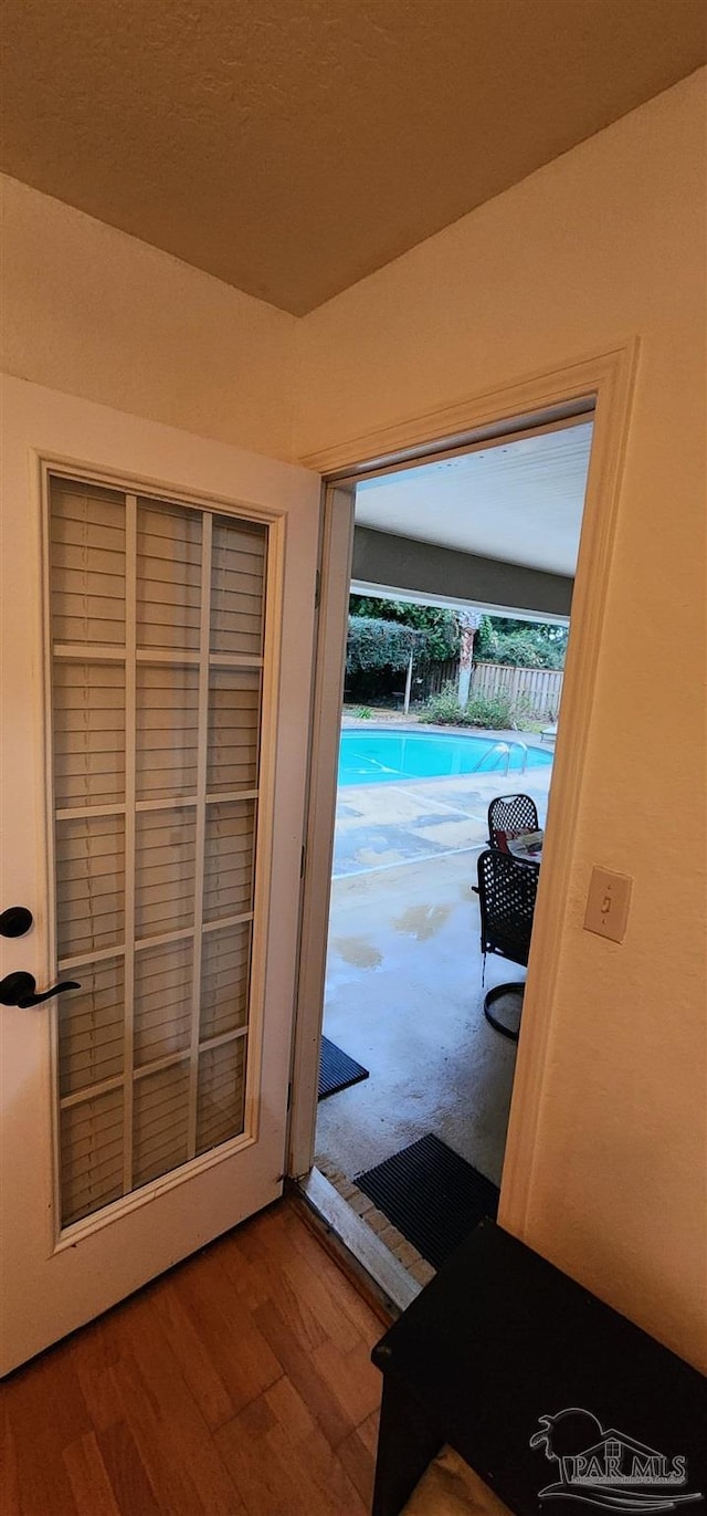 doorway to outside featuring wood finished floors