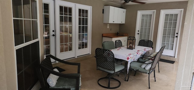 dining space featuring french doors and ceiling fan