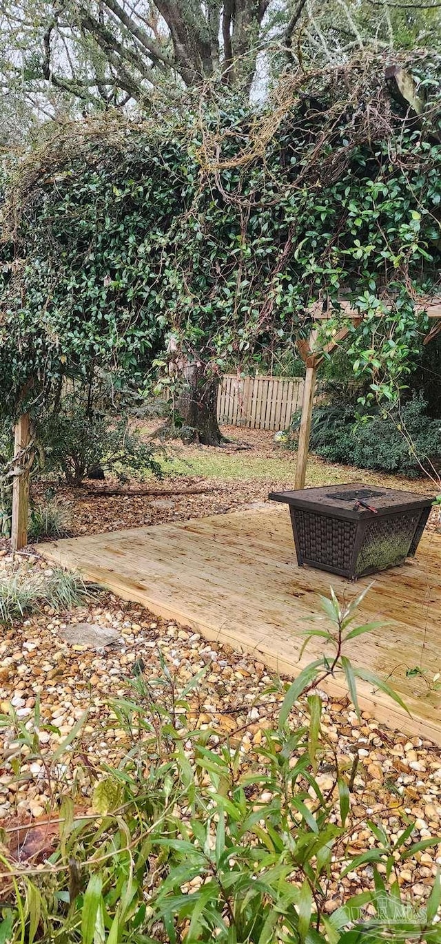 view of yard with fence and a deck