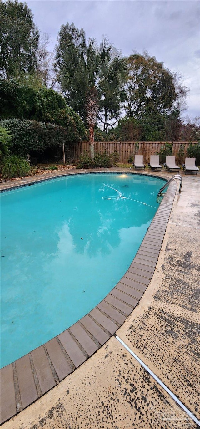 view of pool with a patio area, fence, and a fenced in pool