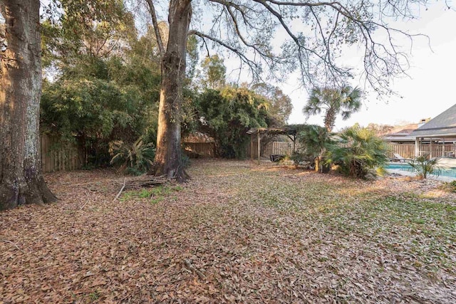 view of yard featuring a fenced backyard and a fenced in pool