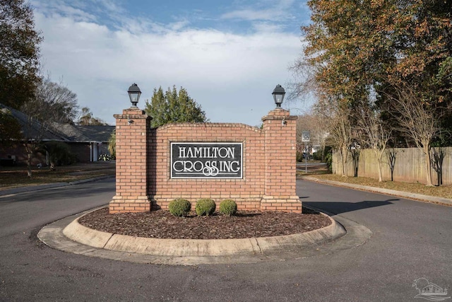 community sign with fence