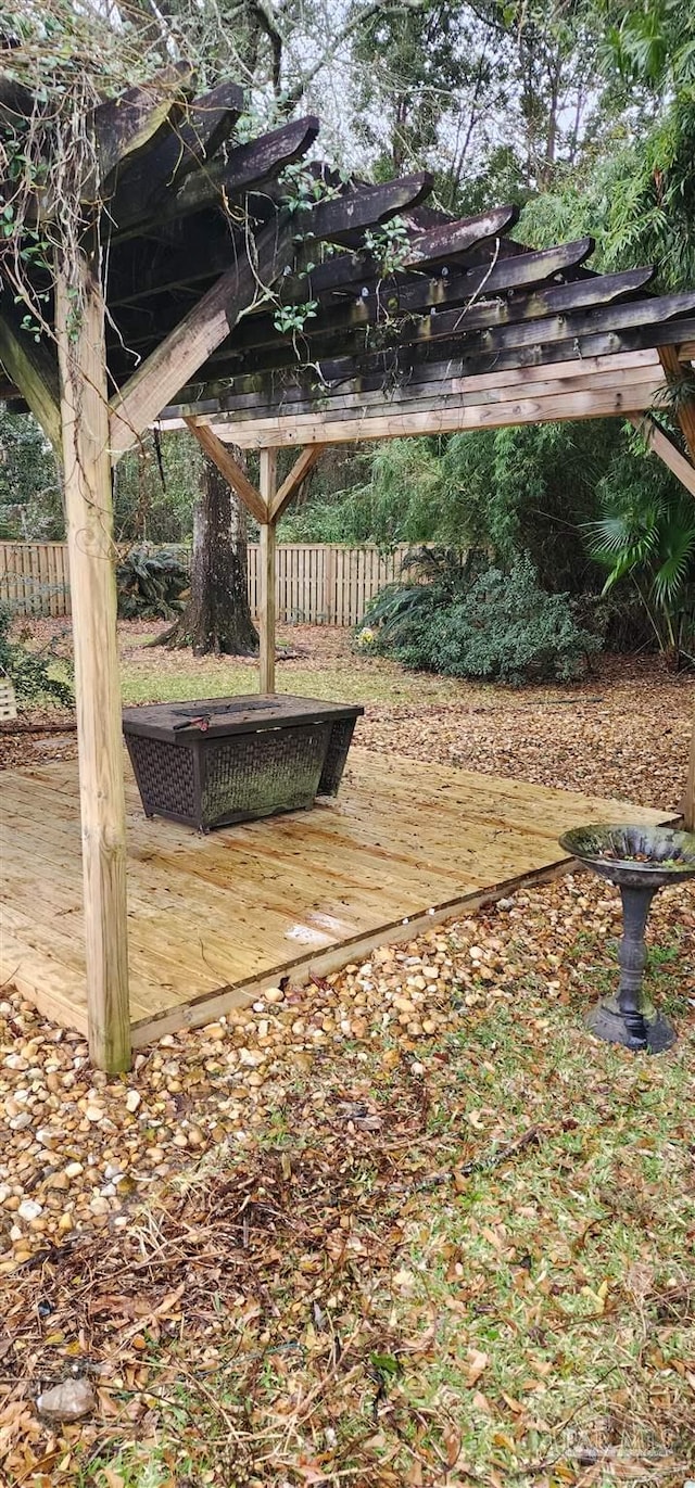 view of yard with fence and a deck