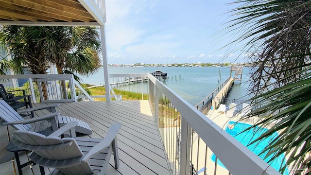 wooden terrace featuring a water view