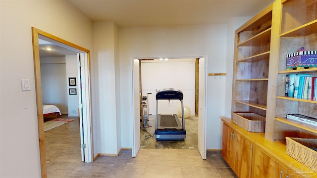 hall featuring light tile patterned floors