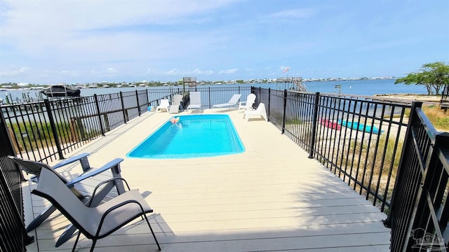 view of pool featuring a water view