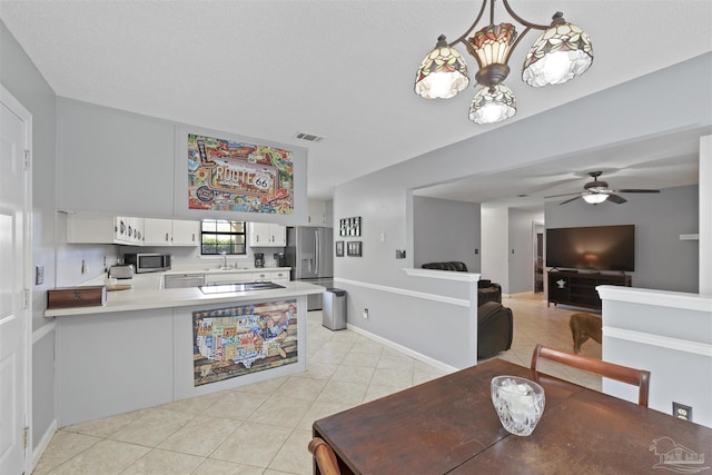 dining area with ceiling fan, light tile patterned flooring, and visible vents
