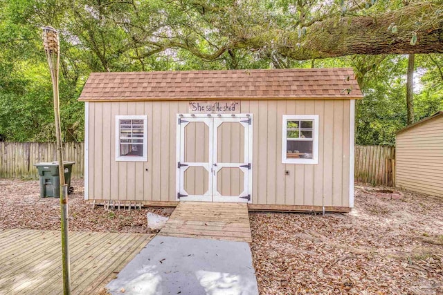 view of shed with fence