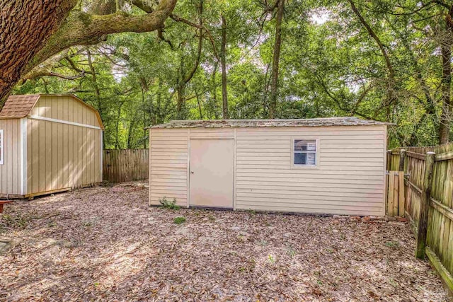 view of shed with a fenced backyard