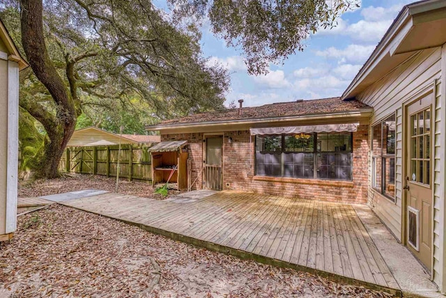 deck with a fenced backyard
