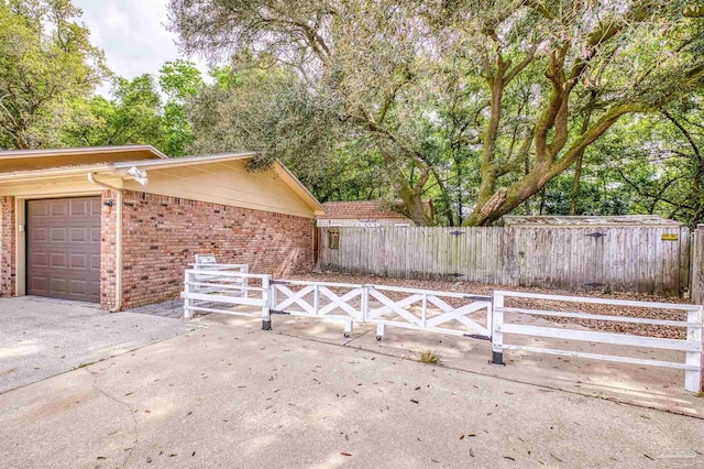 view of gate featuring fence