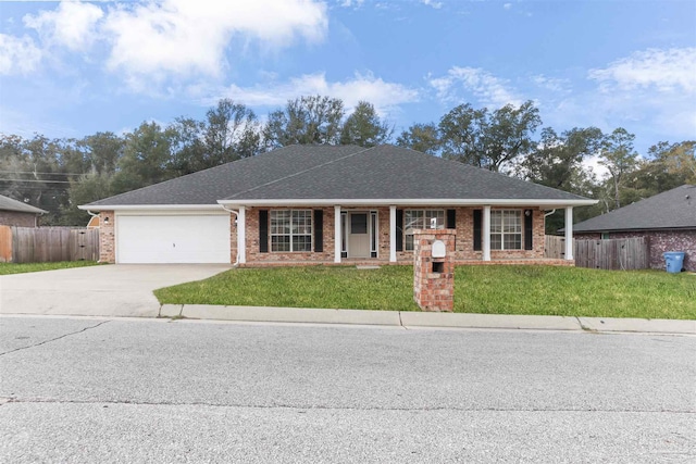 ranch-style home with a garage and a front yard