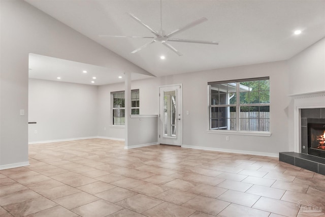 unfurnished living room featuring lofted ceiling and ceiling fan