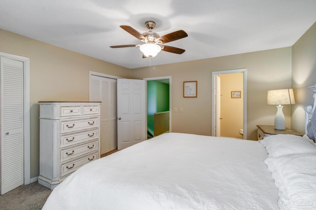 bedroom featuring multiple closets, ceiling fan, and carpet