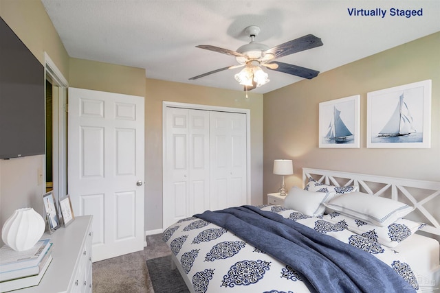 bedroom with a closet, ceiling fan, and carpet flooring