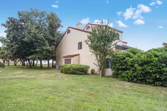 view of home's exterior featuring a yard