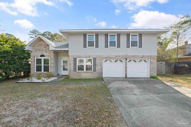 front facade featuring a garage and a front yard