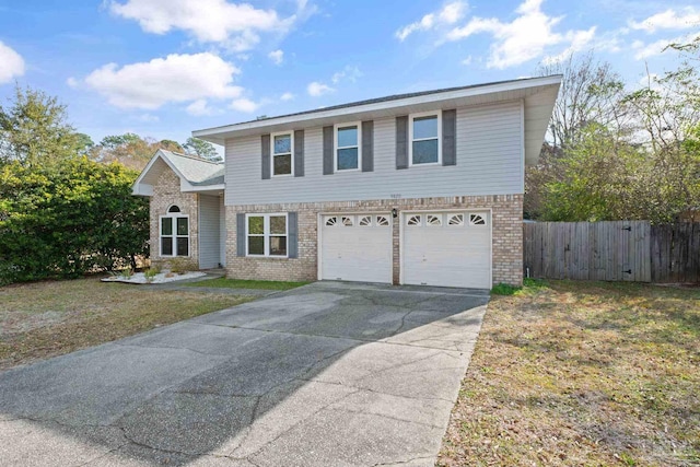 view of front property with a garage and a front yard