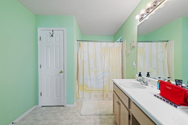 bathroom featuring vanity and a textured ceiling