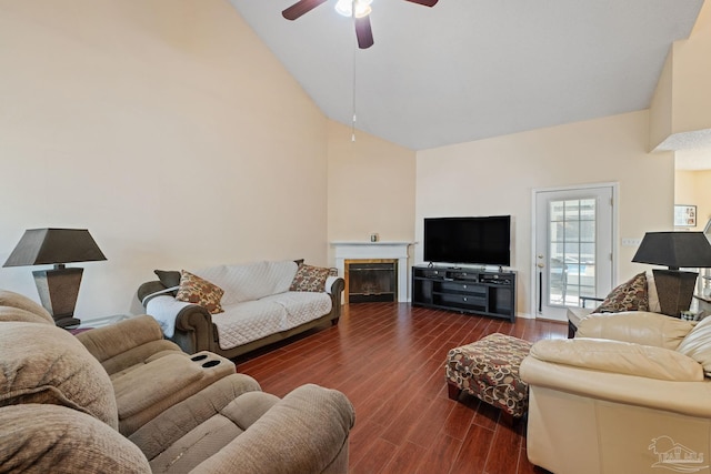 living room featuring ceiling fan, high vaulted ceiling, and dark hardwood / wood-style flooring