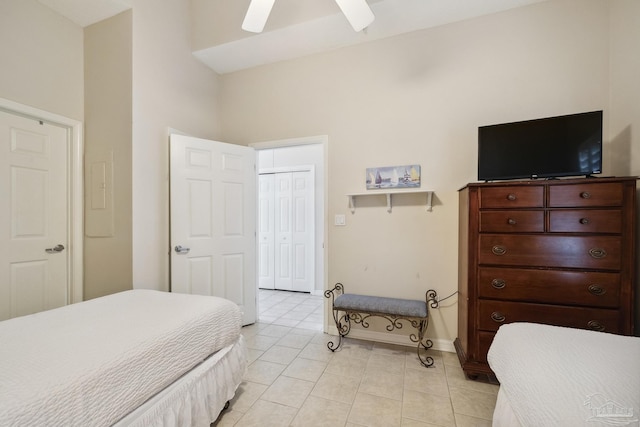 tiled bedroom with a closet and ceiling fan