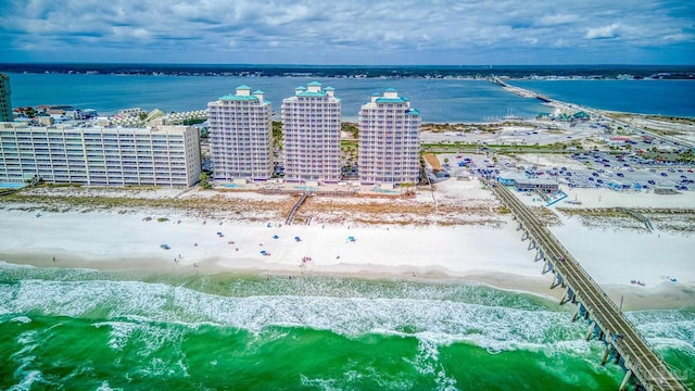 birds eye view of property featuring a water view and a view of the beach