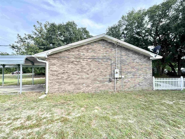 5737 Chumuckla Hwy, Pace, FL 32571 - view of home's exterior with brick siding and a carport