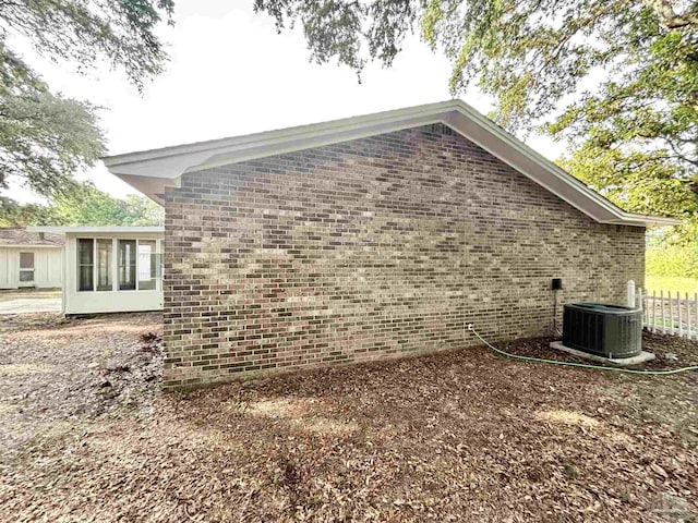 5737 Chumuckla Hwy, Pace, FL 32571 - view of home's exterior featuring central AC unit and brick siding