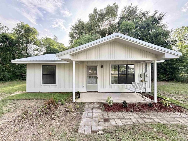 5737 Chumuckla Hwy, Pace, FL 32571 - view of front of property featuring a porch and metal roof