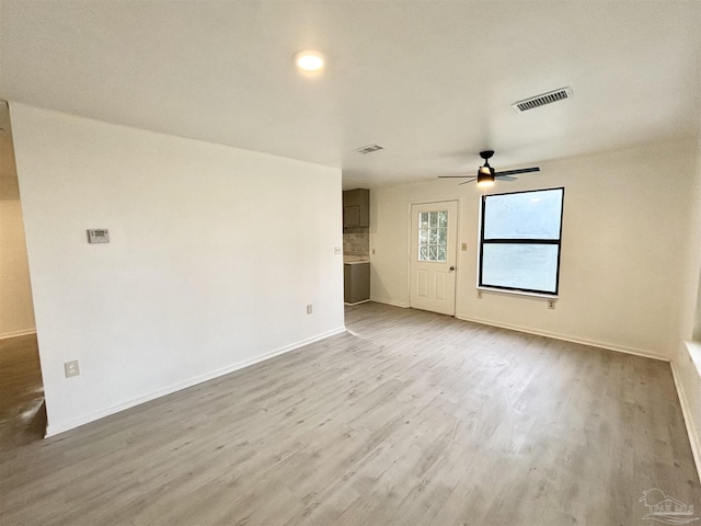 5737 Chumuckla Hwy, Pace, FL 32571 - unfurnished room with wood finished floors, ceiling fan, and baseboards