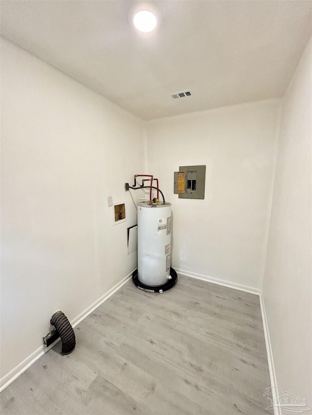 5737 Chumuckla Hwy, Pace, FL 32571 - laundry room with water heater, electric panel, wood finished floors, baseboards, and washer hookup
