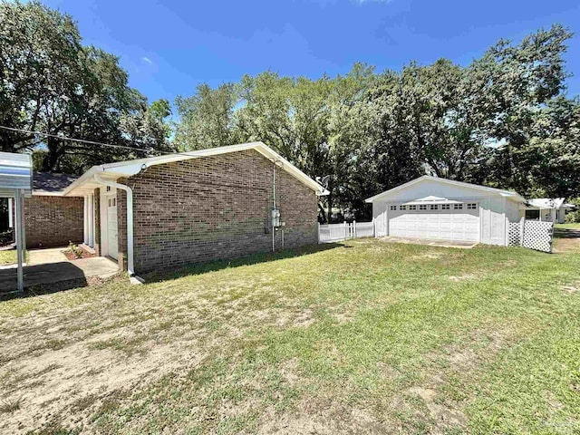 5737 Chumuckla Hwy, Pace, FL 32571 - view of side of property featuring brick siding and a detached garage