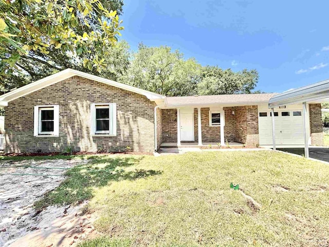 5737 Chumuckla Hwy, Pace, FL 32571 - ranch-style home featuring a garage, brick siding, and a front yard