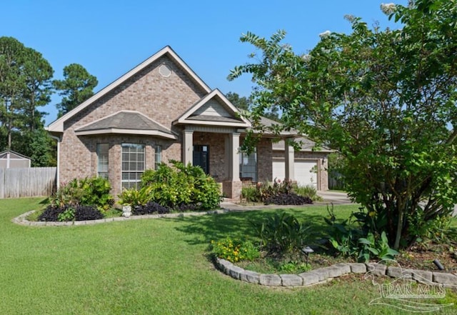 view of front facade with a front yard and a garage