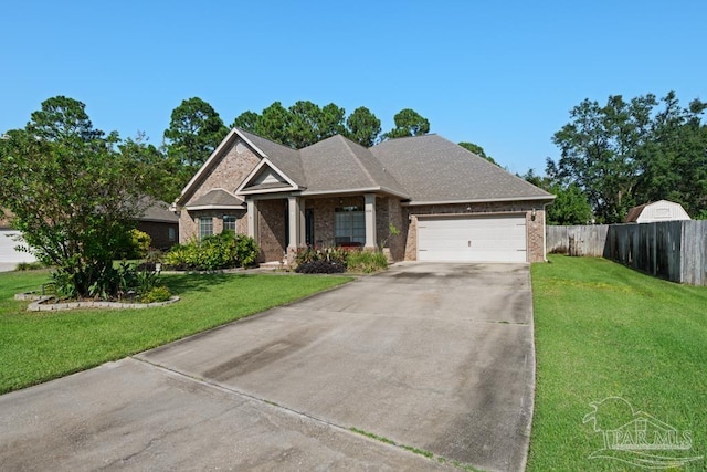 view of front of home featuring a front lawn and a garage