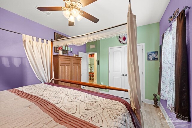 bedroom featuring hardwood / wood-style floors and ceiling fan