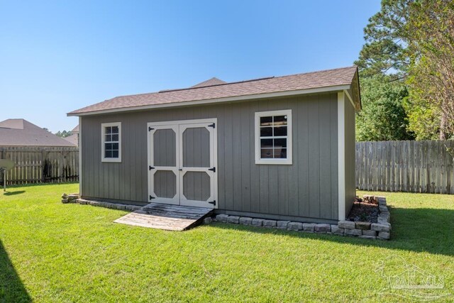 view of outdoor structure with a yard