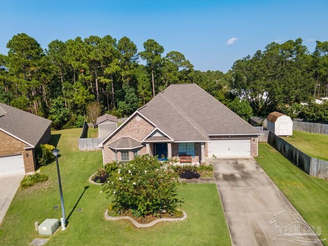 view of front facade featuring a front yard and a garage