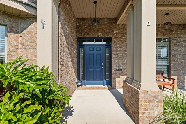 property entrance featuring covered porch