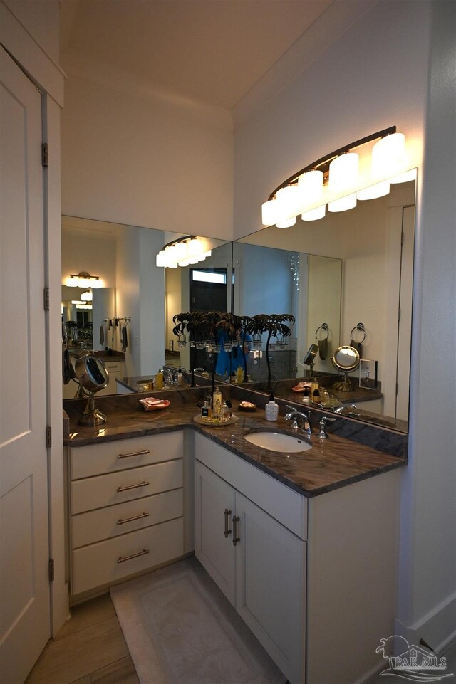 bathroom featuring sink and wood-type flooring