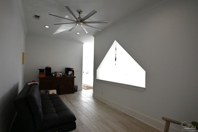 interior space with ceiling fan and light hardwood / wood-style flooring