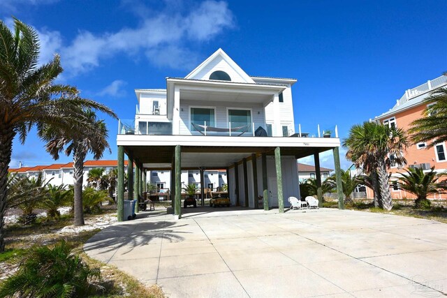 coastal inspired home featuring a carport