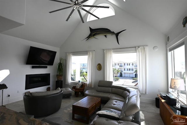 living room with ceiling fan, high vaulted ceiling, and wood-type flooring