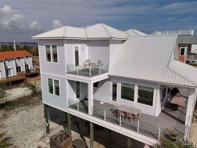 back of house with a balcony