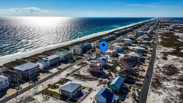 drone / aerial view featuring a water view and a beach view